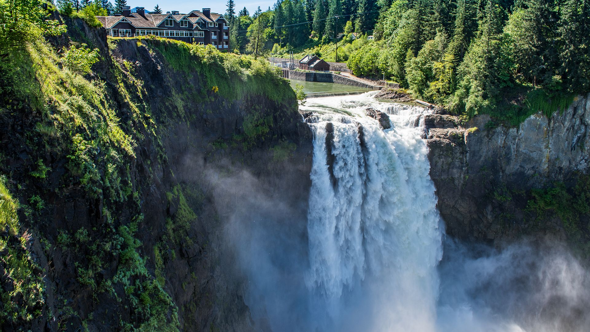 Snoqualmie Falls With A House In The Background